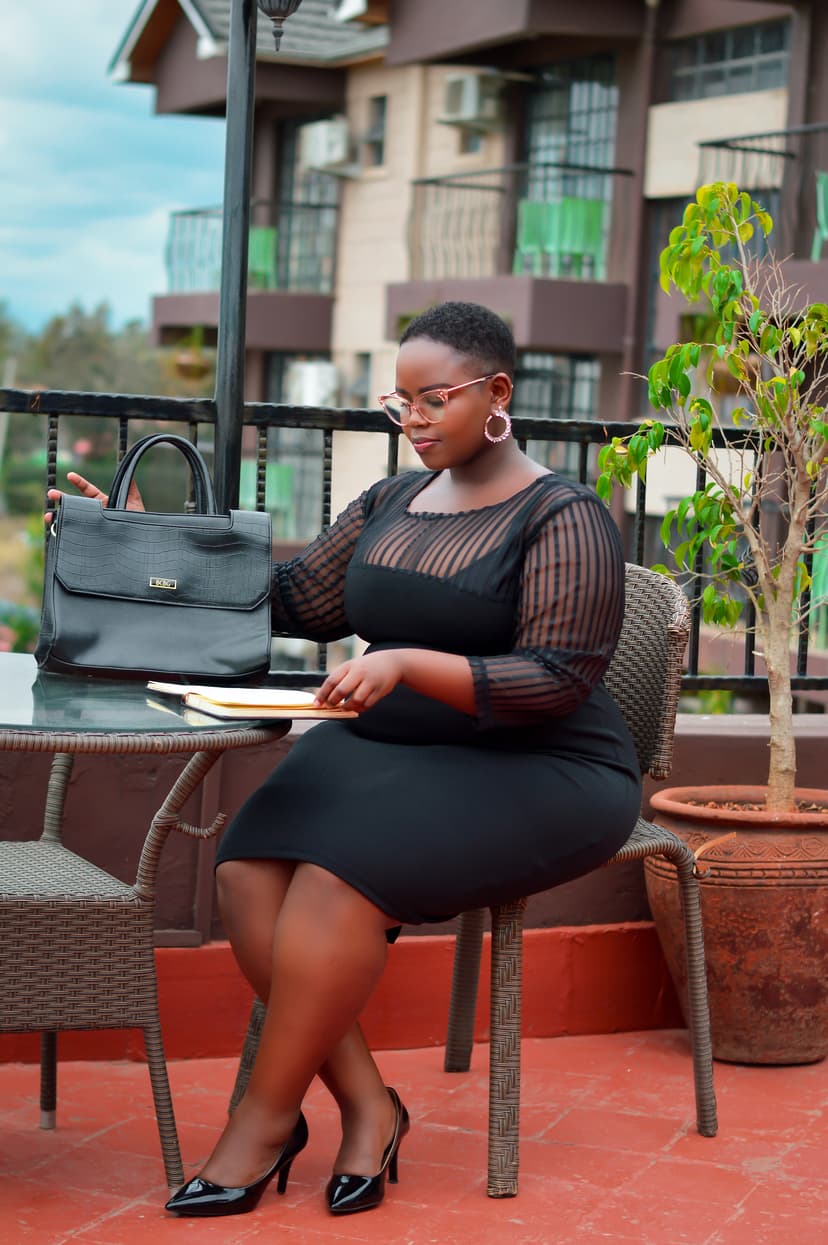 Black lady sitting at table